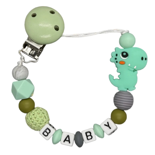 Attache tétine prénom dinosaure en silicone vert Attache tétine prénom dinosaure en silicone vert